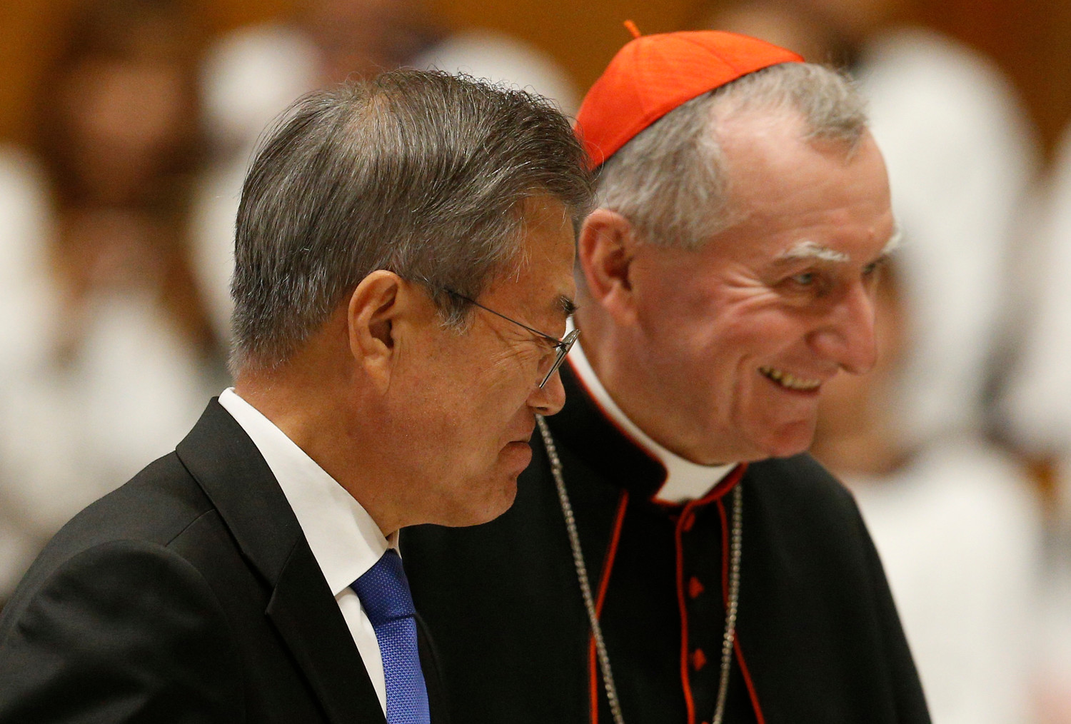 South Korean President Moon Jae-in walks next to Cardinal Pietro Parolin, Vatican secretary of state, as he prepares to speak after a Mass for peace for the Korean peninsula in St. Peter’s Basilica at the Vatican Oct. 17.
